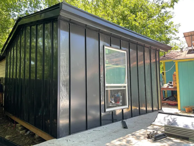 Black standing seam metal wall panels for Roof Inspection in Goulds